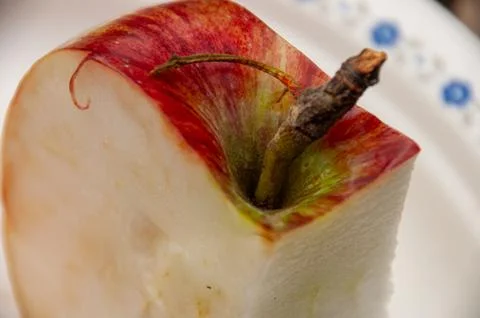 A Close-up of a Apple Slice on a White Plate Stock Photos