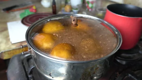 Close-up of apples boiling in a pot with water Stock Footage 141050078