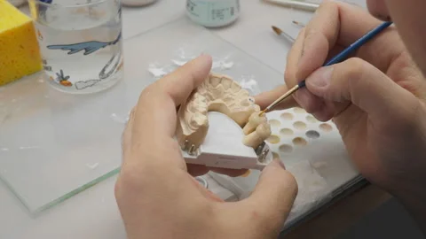 Close Up Of Application Of Ceramic Material For Production Of Artificial Tooth Stock Footage 200872216