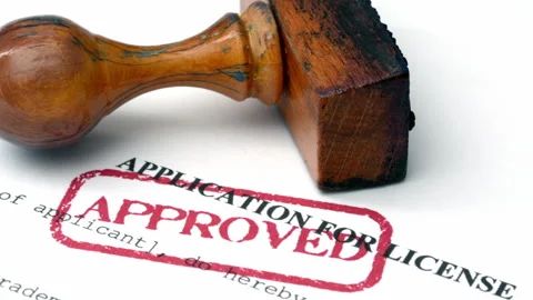 Close up of application for license approved Stock Footage 345535602