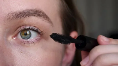 Close up Applying black mascara on eyelashes with a makeup brush Stock Footage 219418675