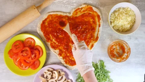 Close-up of applying fragrant pizza sauce Stock Footage 221148709
