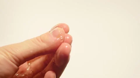 Close up applying gel on hands. Video stock 148166807