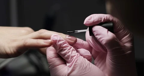 Close-up of applying gel polish on the nail. Stock Footage 103807899