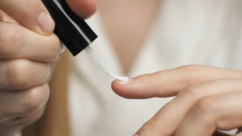 Close-up of applying nail polish on a nail. Nail brush. Manicure. Beauty care Stock Footage 267209470