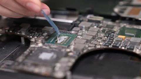 Close-up applying thermal paste to computer processor chip. Computer service Stock Footage 283385251