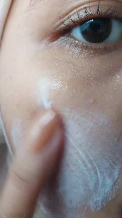 Close up of applying white cream on cheek to conceal acne, skincare and cos.. Stock Footage 331255149