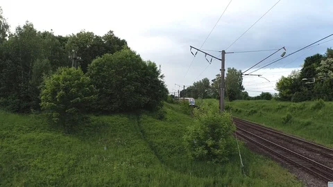 Close approach passengers train on the bridge through highway Stock Footage 104707241