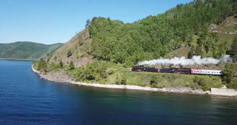Close approach passengers train Trans Siberian railway brick bridge. Lake Baikal Video stock 123418367