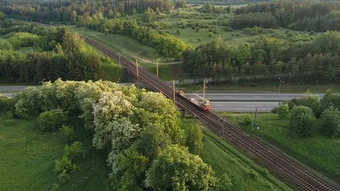 Close approach of rail road crane on the bridge through highway Stock Footage 104707679