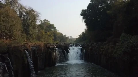 Close approach to waterfall by drone, Tad Pha Suam Waterfall in Laos. Stock Footage 102655377