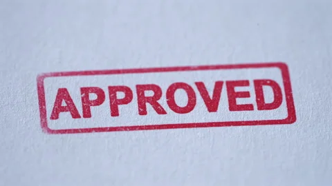 Close Up of Approved Stamp Coming Down on Paper Stock Footage 341898742