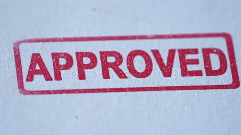 Close Up of Approved Stamp Coming Down on Paper Stock Footage 341898756