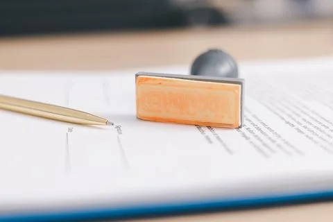 Close up approved stamp on signed document with pen on desk, concept of suc.. Foto stock
