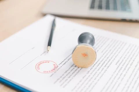 Close up approved stamp on signed document with pen on desk, concept of suc.. Foto stock