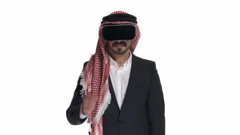 Close-up of Arab man in VR headset playing games, isolated on white. 3D cyber Stock Footage 125831557