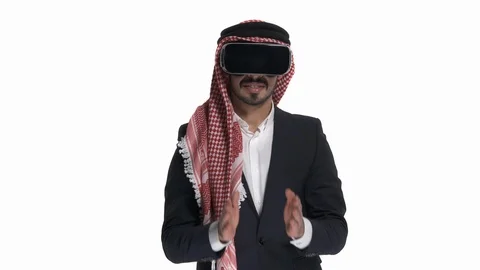 Close-up of Arab man in VR headset playing with virtual opponent, isolated on Stock Footage 125831613