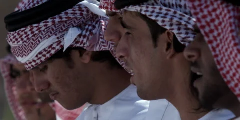 Close up of Arabic men performing traditional dance with sticks. Stock Footage 46871614