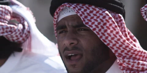 Close up of Arabic men performing traditional dance with sticks. Stock Footage 46871692