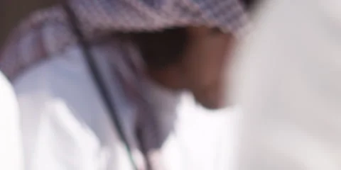 Close up of Arabic men performing traditional dance with sticks. Stock Footage 46871768