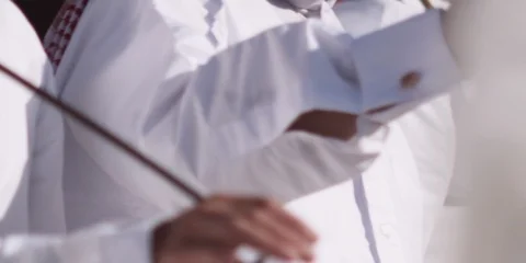 Close up of Arabic men performing traditional dance with sticks. Video stock 124591043