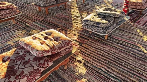Close Up of Arabic Patterned Cushions and Woven Carpets on Floor of Bedouin Stock Footage 341840012