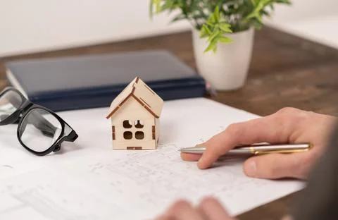 Close up on Architect drawing a construction project (plan, compass,house ) Stock-Fotos