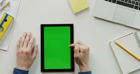 Close up of the architect work desk with a laptop and black vertical tablet Stock Footage 96048163