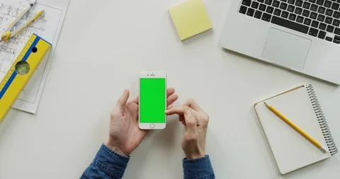 Close up of the architect work desk with a laptop and white vertical smartphone Stock Footage 96048228