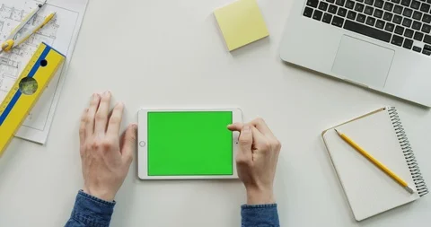 Close up of the architect work desk with a laptop and white horizontal tablet Stock Footage 96186817