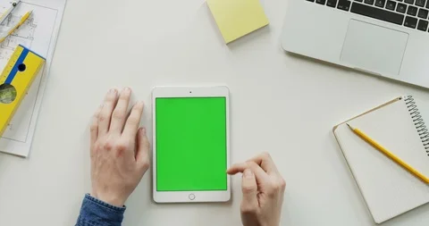 Close up of the architect work desk with a laptop and white vertical tablet Stock Footage 96186883
