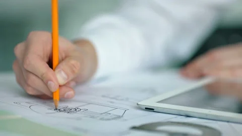 Close-up of architect's hand working in office Видео 85531996