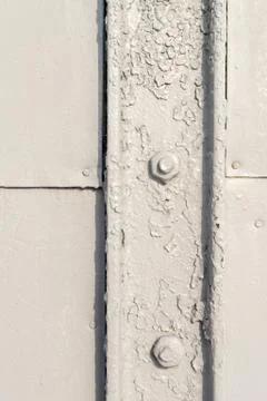 Close up architectural image of grey painted bolts used for securing light me Stock Photos