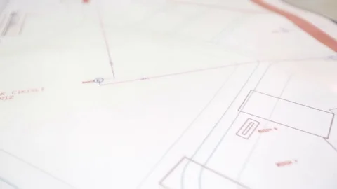 Close up of archtect pointing at building drawing on blueprint. Building project Stock Footage 128929508
