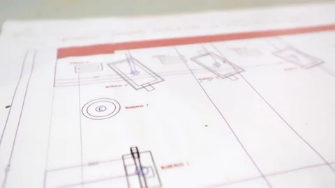 Close up of archtect pointing at building drawing on blueprint. Building project Stock Footage 128929510