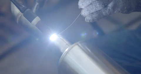 Close up argon welding.Car pipe welding.The hand of a mechanic or welder. Stock Footage 281440804