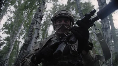 Close-up, an armed soldier with a weapon, with a rifle in his hands Stock Footage 327352261
