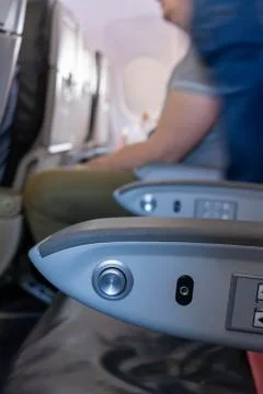 Close Up of Armrest inside an Airplane during Flight Stock Photos