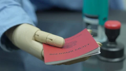 Close up arms of disabled employee with prosthetic arm doing paperwork Stock Footage 249376169