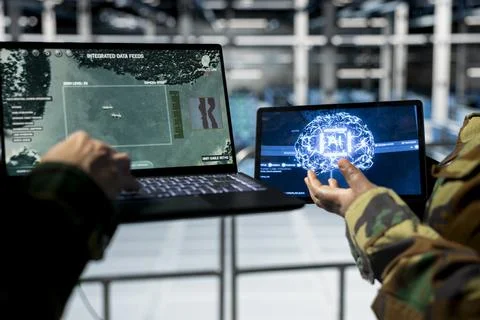 Close up of army experts in data center tracking missile trajectories using AI Stock Photos