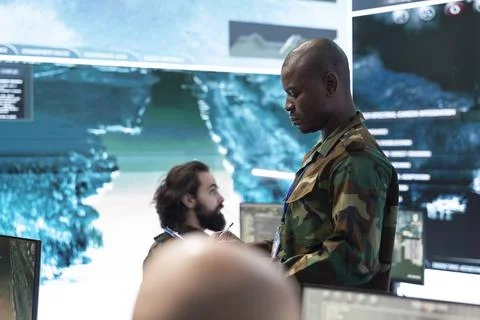 Close up of army officer analyzing operation data with tablet Fotos Stock