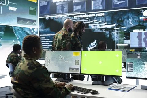 Close up of army operator using green screen mockup PC monitor Stock Photos