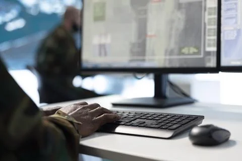 Close up of army operator using PC monitor to track enemy ballistic missiles Stock Photos