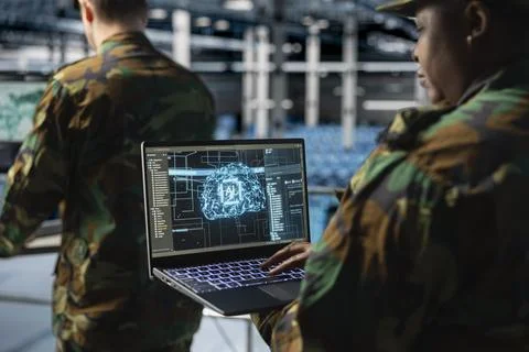 Close up of army technology expert in data center analyzing threats with AI Stock Photos