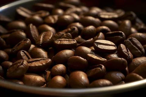  Close-up of aromatic coffee beans representing the rich taste of espresso... Stockfoto's