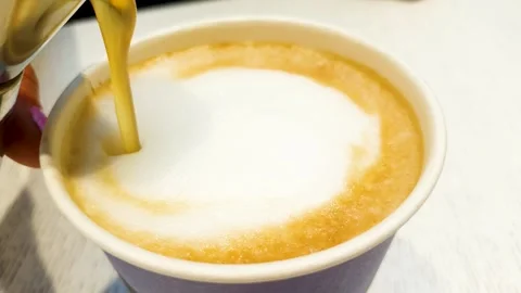 Close-up of aromatic sweet syrup being added to coffee. Syrup in coffee. Stock Footage 314340616