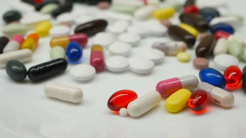 Close up, around rotating with red, white, colored pills 動画素材 85742749