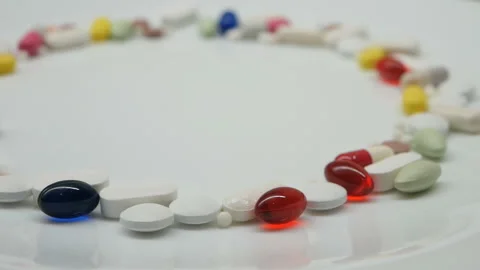 Close up around rotating with red, white, colored pills Stock Footage 85743028