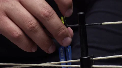 Close up of arrow being set in place on bow string Stock Footage 148868269