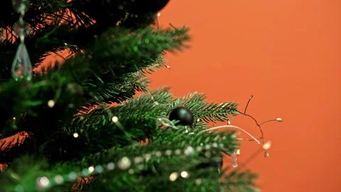 Close-up of an artificial Christmas tree decorated with stylish black Stock Footage 303566874